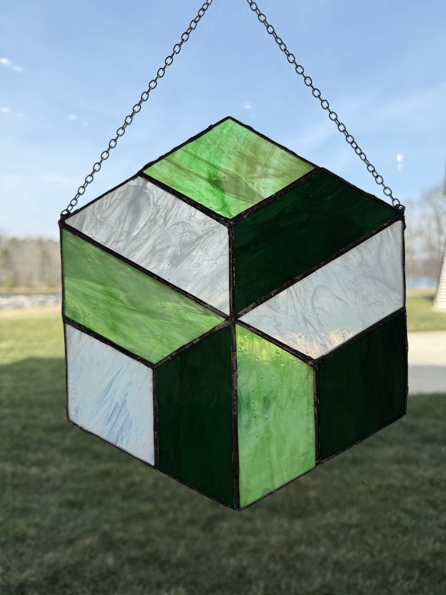 Green geometric tumbling blocks sun catcher